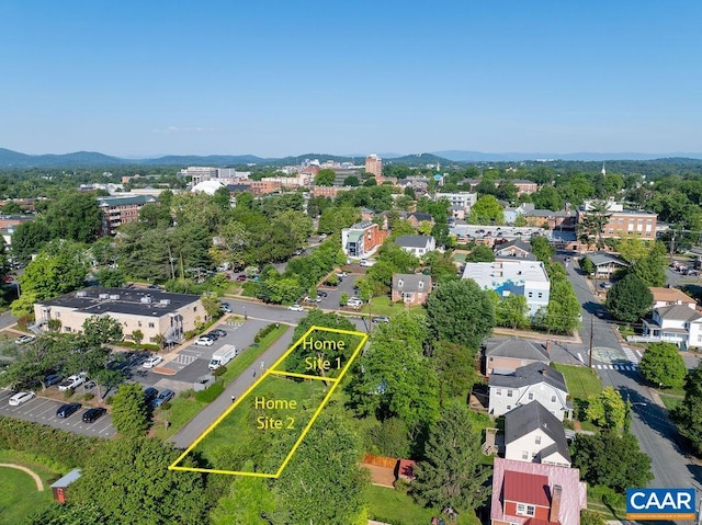 birds eye view of property featuring a mountain view