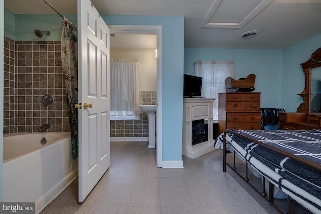 bedroom with visible vents and baseboards