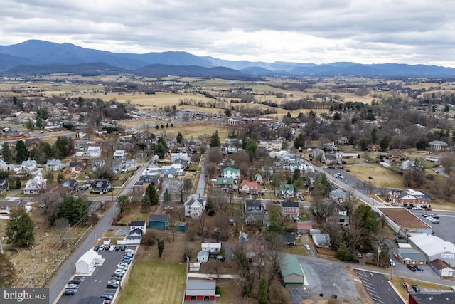 birds eye view of property featuring a mountain view