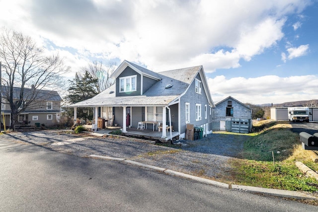 view of front of property with a porch and a garage