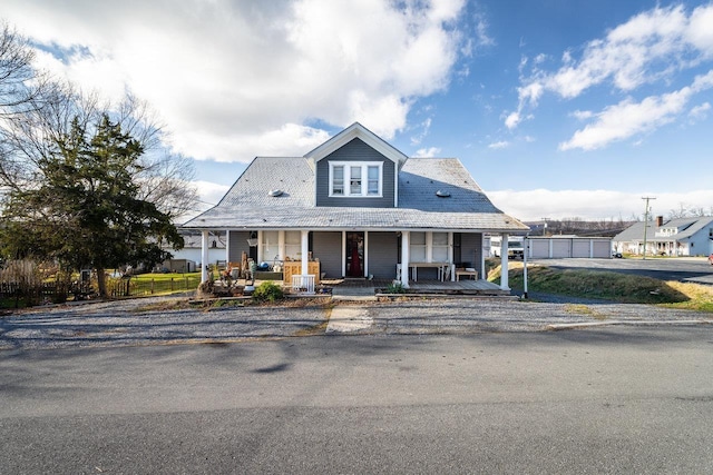 view of front facade with a garage and a porch