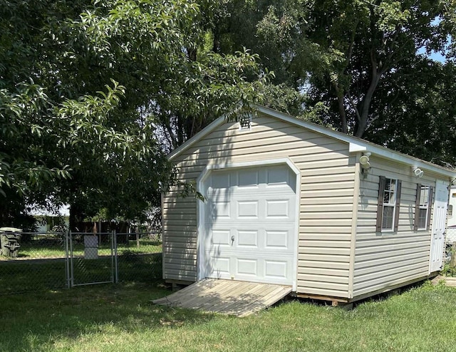 garage featuring a yard