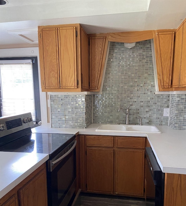 kitchen featuring tasteful backsplash, dishwasher, sink, and electric stove