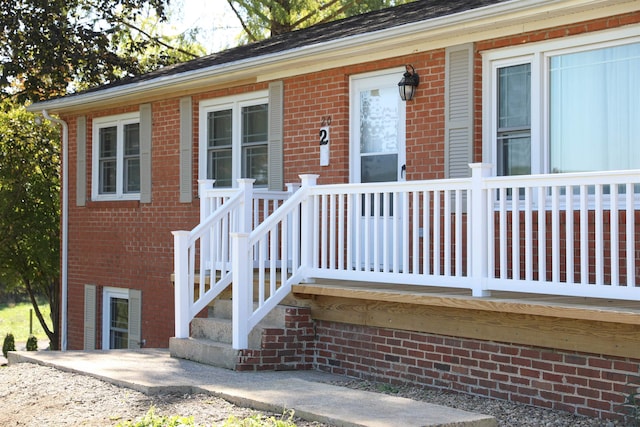 exterior space with brick siding