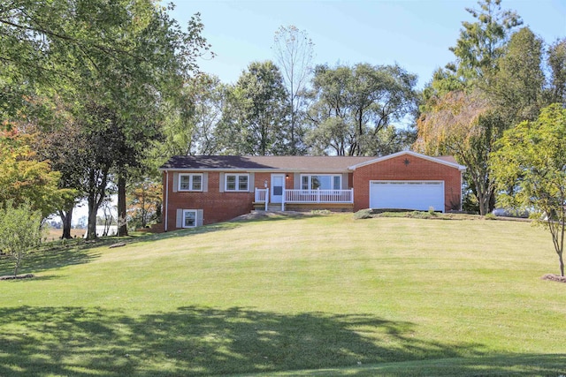 single story home with an attached garage, a front lawn, and brick siding