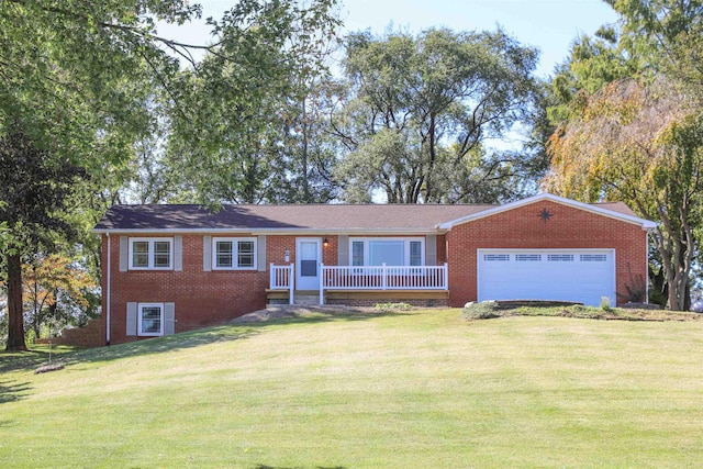 single story home with a garage, a front yard, and brick siding