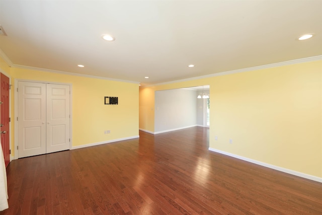 empty room with baseboards, ornamental molding, dark wood-type flooring, and recessed lighting