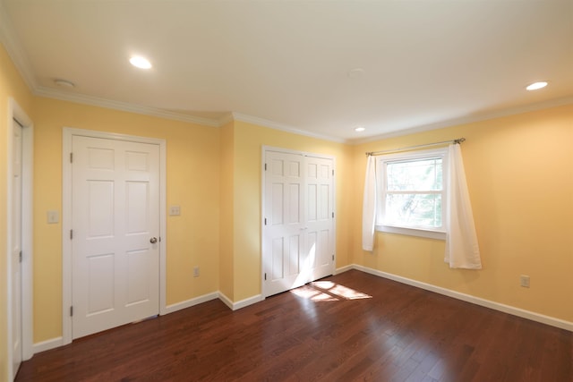 unfurnished bedroom with crown molding, dark wood-style flooring, recessed lighting, and baseboards