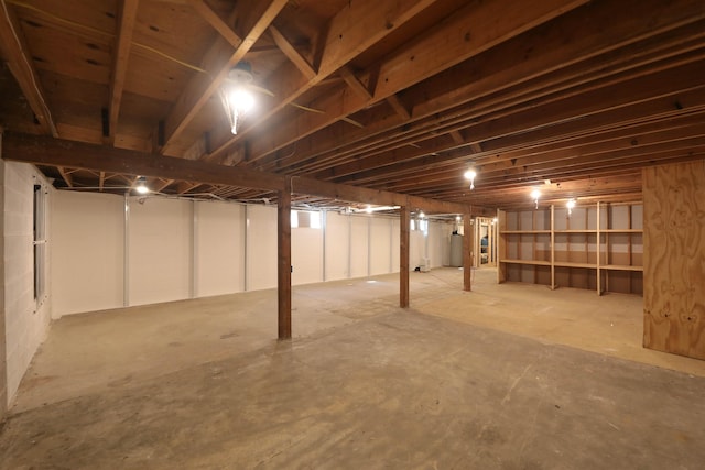 unfinished basement with gas water heater