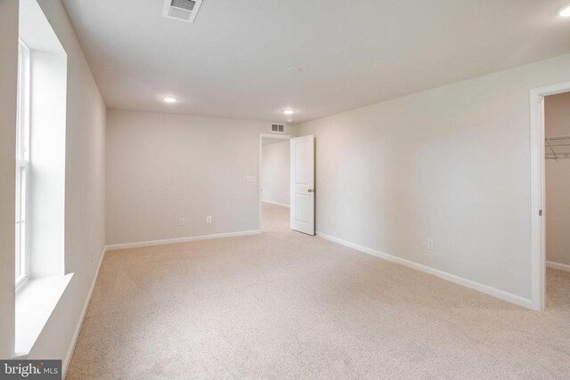 empty room with light colored carpet