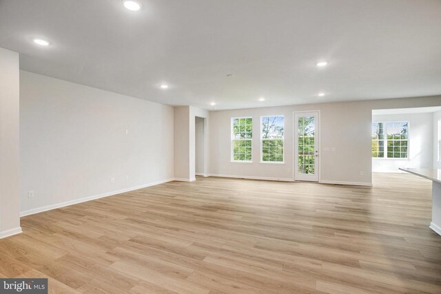 spare room featuring light hardwood / wood-style floors