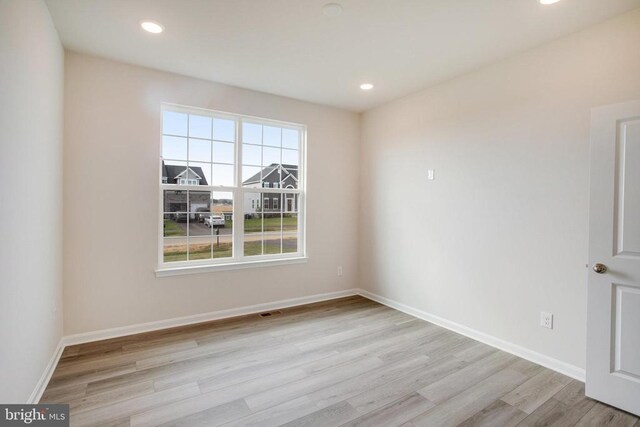 empty room featuring light hardwood / wood-style floors