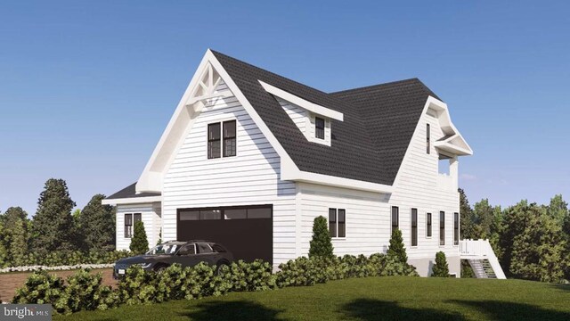 view of front of home with a garage and a front yard