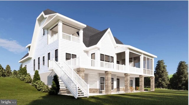 back of property featuring a sunroom and a lawn