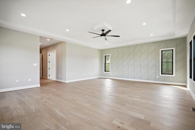 unfurnished room featuring ceiling fan and light hardwood / wood-style floors