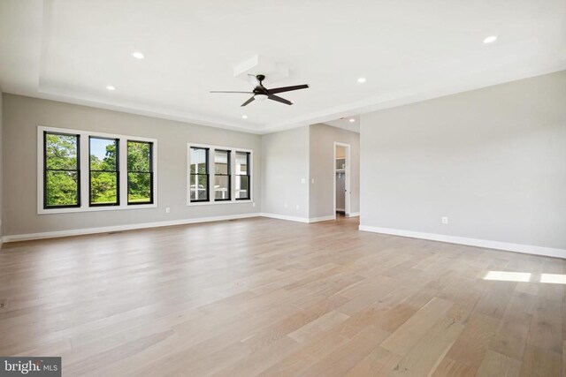 spare room featuring ceiling fan and light hardwood / wood-style floors