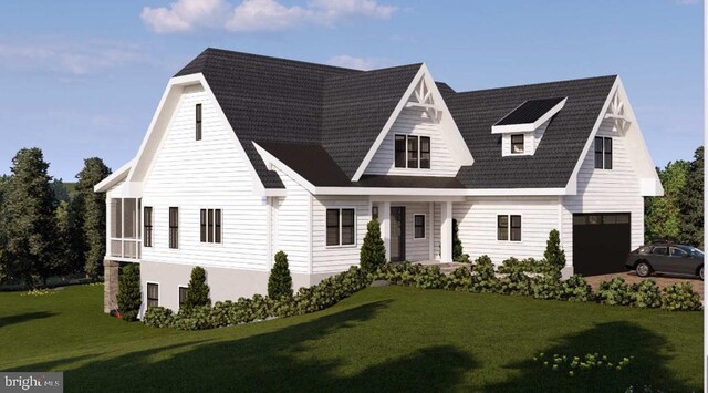 view of front of property with a garage and a front lawn