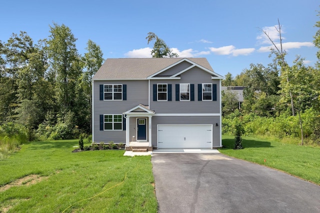 view of front facade featuring driveway, an attached garage, and a front lawn