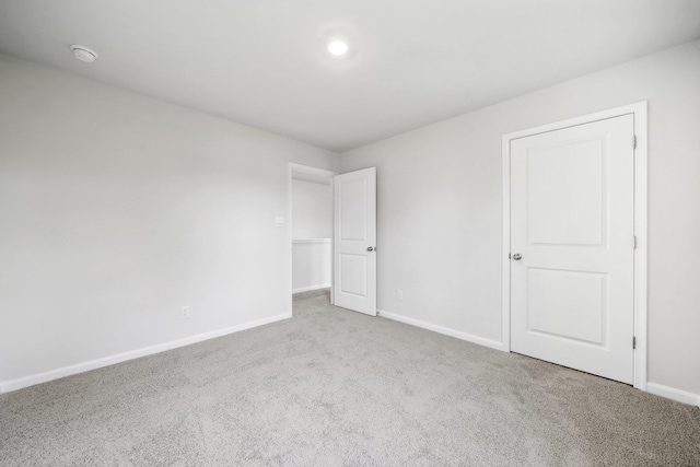 unfurnished bedroom featuring baseboards and carpet floors