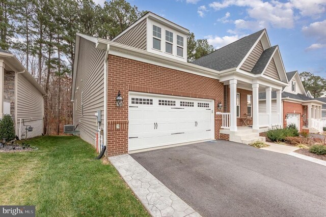 view of front of house with a garage and a front lawn