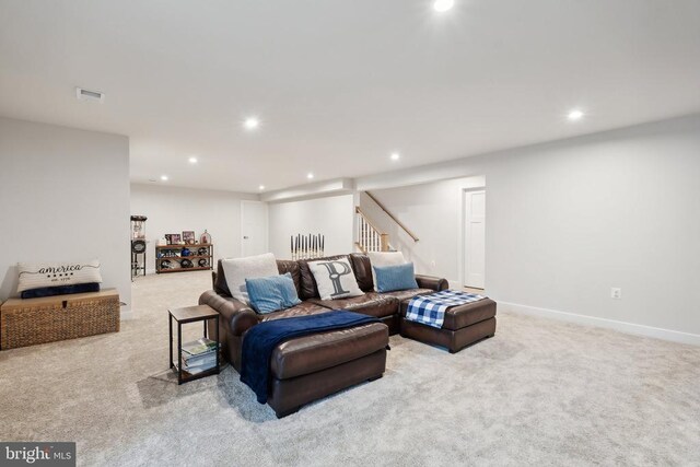 living area with recessed lighting, visible vents, carpet floors, and baseboards