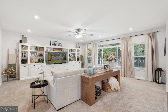 living area with recessed lighting, carpet floors, and ceiling fan