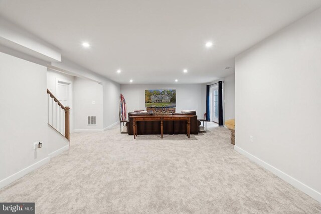 interior space with visible vents, light carpet, recessed lighting, stairway, and baseboards