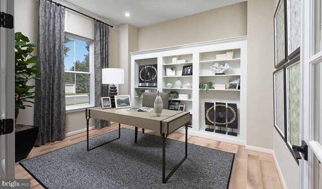 home office featuring hardwood / wood-style flooring