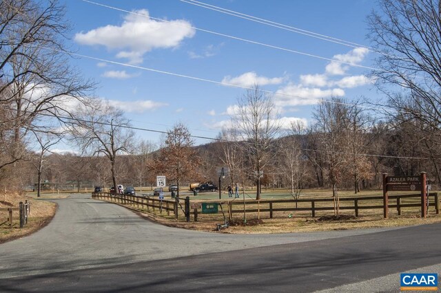 view of community with fence