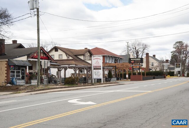 view of road featuring curbs and sidewalks