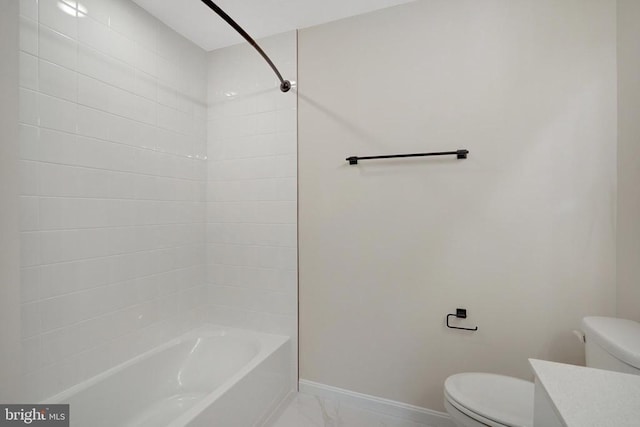 full bathroom featuring baseboards, toilet,  shower combination, marble finish floor, and vanity