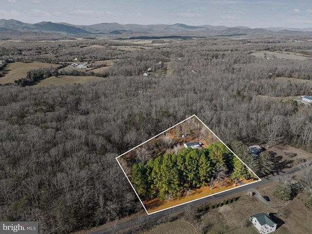 drone / aerial view featuring a mountain view