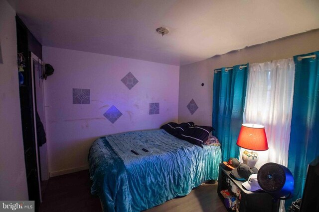 bedroom featuring hardwood / wood-style floors