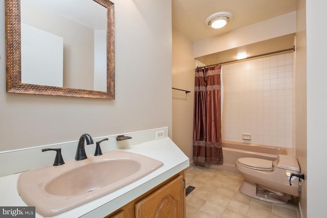 full bath featuring toilet, tile patterned floors, shower / tub combo, and vanity