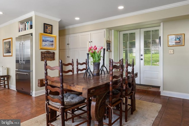 dining area with recessed lighting, dark tile patterned floors, and baseboards