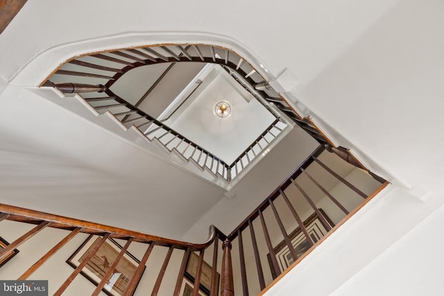 stairway featuring a high ceiling