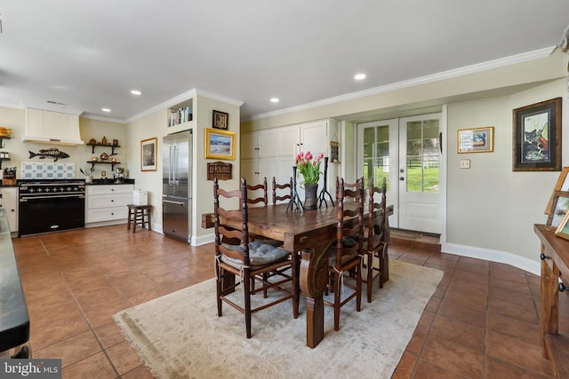 dining room featuring baseboards, ornamental molding, tile patterned floors, and french doors