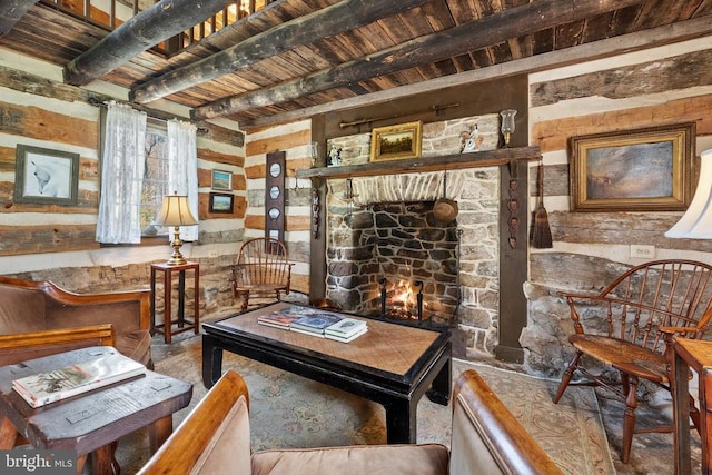 sitting room featuring beamed ceiling, a warm lit fireplace, and wood ceiling