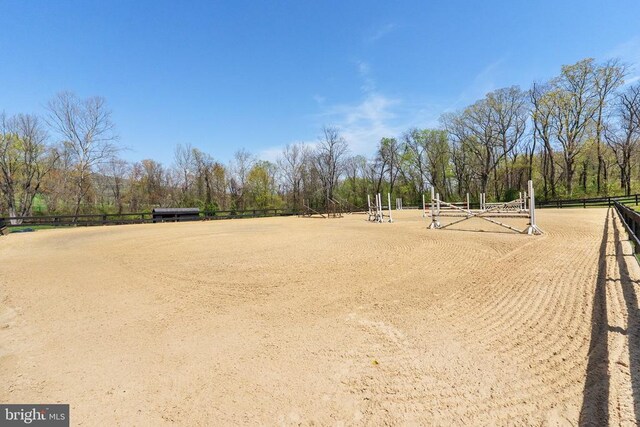 view of home's community with fence and an enclosed area