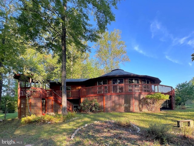 exterior space featuring a deck, stairs, and a yard