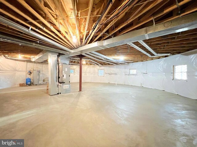 basement featuring heating unit