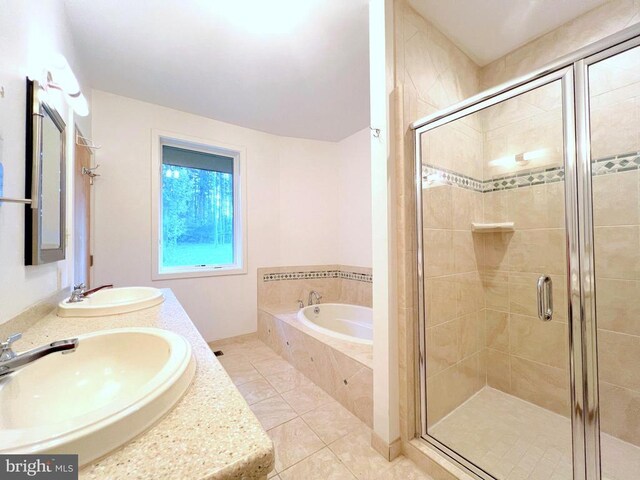 bathroom featuring tile patterned floors, independent shower and bath, and vanity