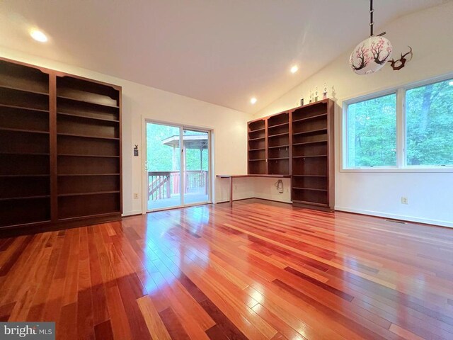 unfurnished living room with recessed lighting, baseboards, lofted ceiling, and hardwood / wood-style flooring