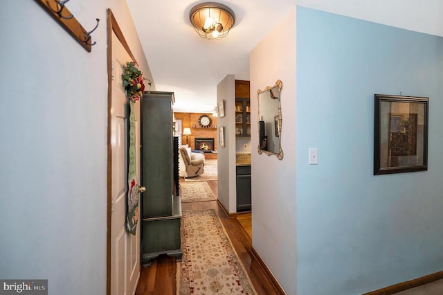 corridor featuring dark hardwood / wood-style flooring