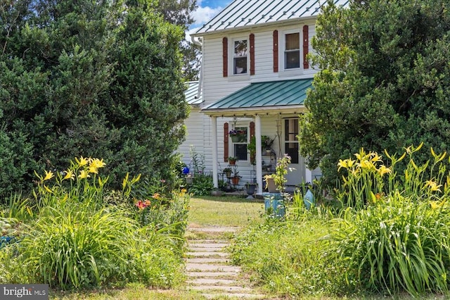 view of front facade featuring a standing seam roof and metal roof