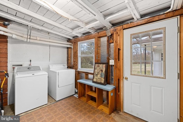 laundry room with washer and dryer, laundry area, and light floors