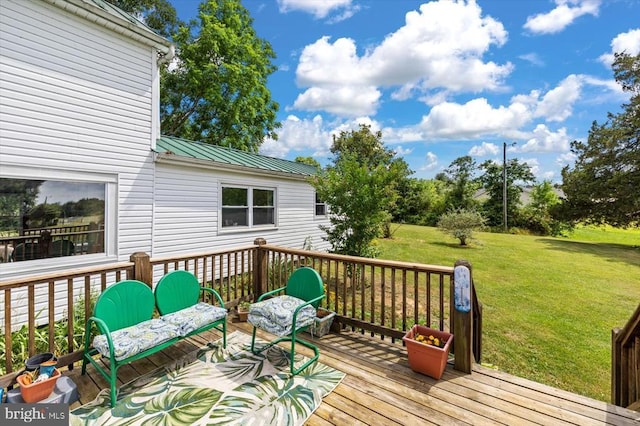 wooden terrace with a yard