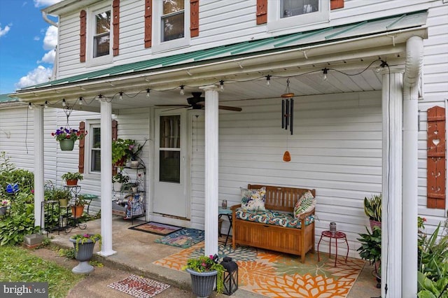 property entrance featuring metal roof and ceiling fan