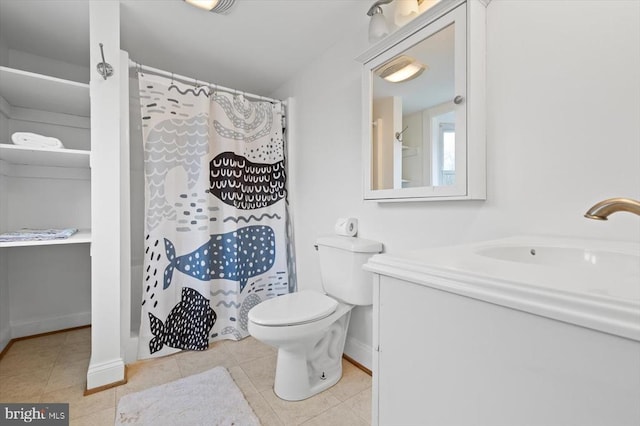 full bathroom with tile patterned flooring, a shower with curtain, toilet, and vanity