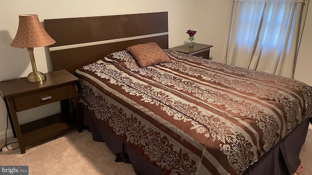 bedroom with light carpet